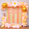 Soft yellow-pink and peach pastel balloon arch.
