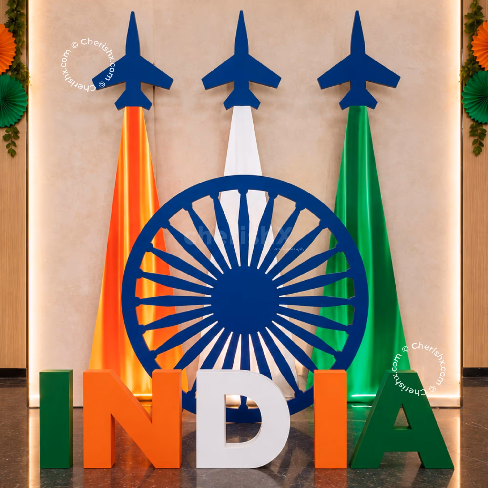 Independence Day Aeroplane Theme Decoration with tricolour aeroplane stands, Ashoka Chakra backdrop, INDIA letter display.