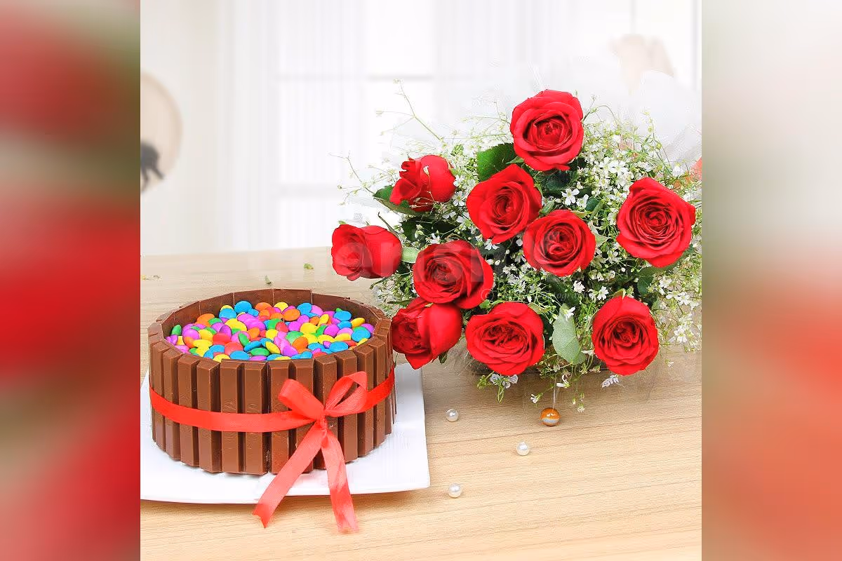 A combo of red roses and Kitkat gems cake.