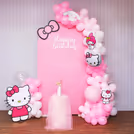 Pastel pink Hello Kitty backdrop for a picture-perfect party.