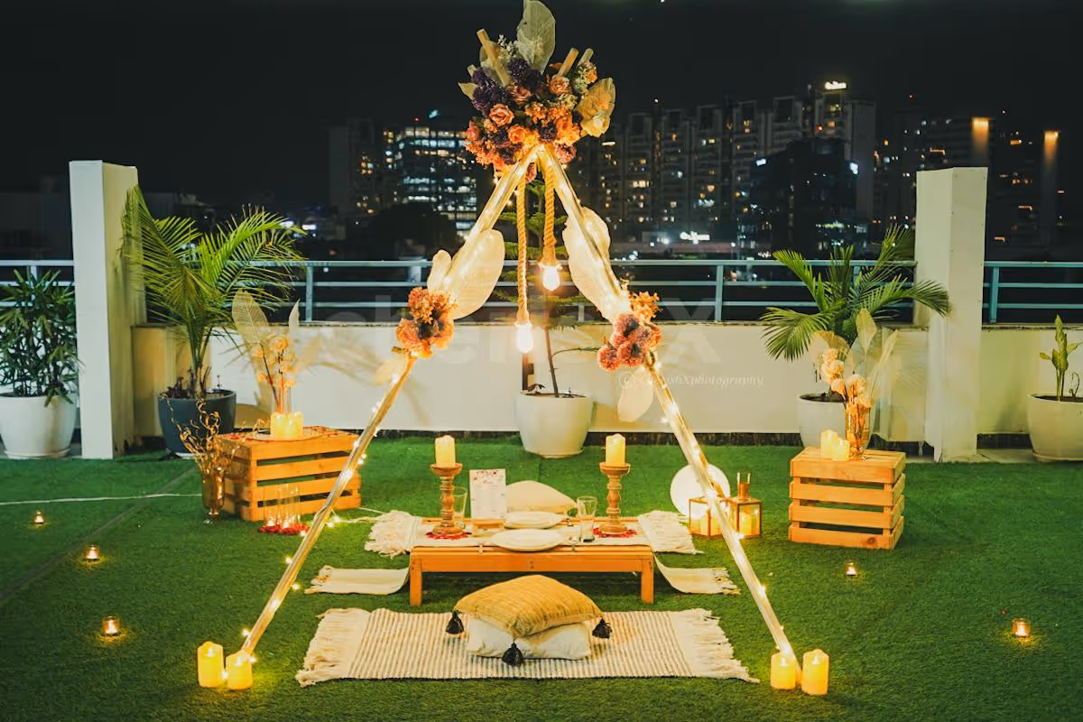 Step into a Bohemian Paradise! LED-lit canopies, vibrant flowers, and hanging lamps create a dreamy atmosphere.