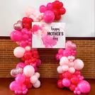 Gorgeous pink and magenta balloon arch for Mother's Day.