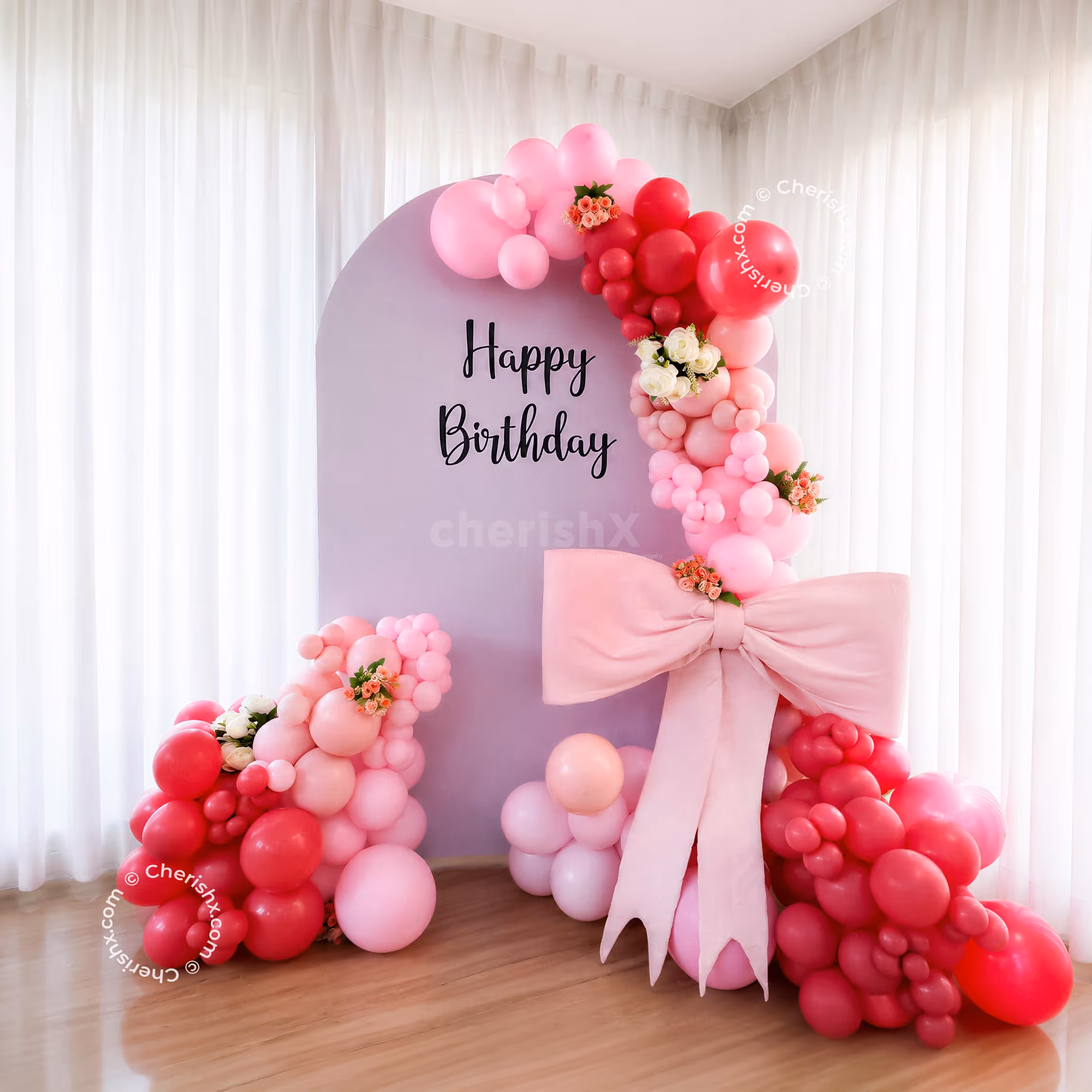 A massive-sized pink bow is the major highlight of the decor, celebrating the Flower wrapping tradition.