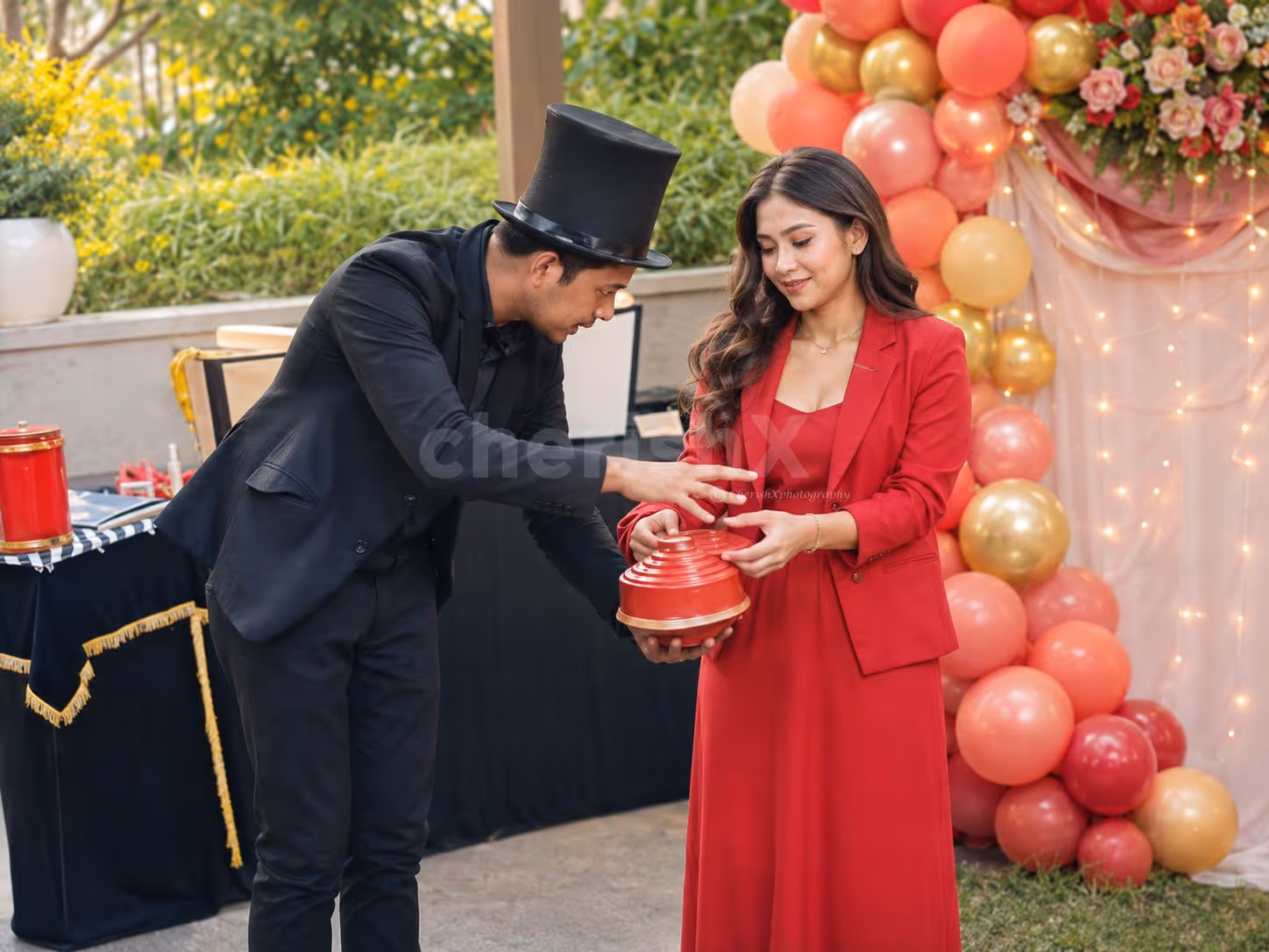 Adults enjoying a party with magic, with guests and a professional magician doing interactive magic.