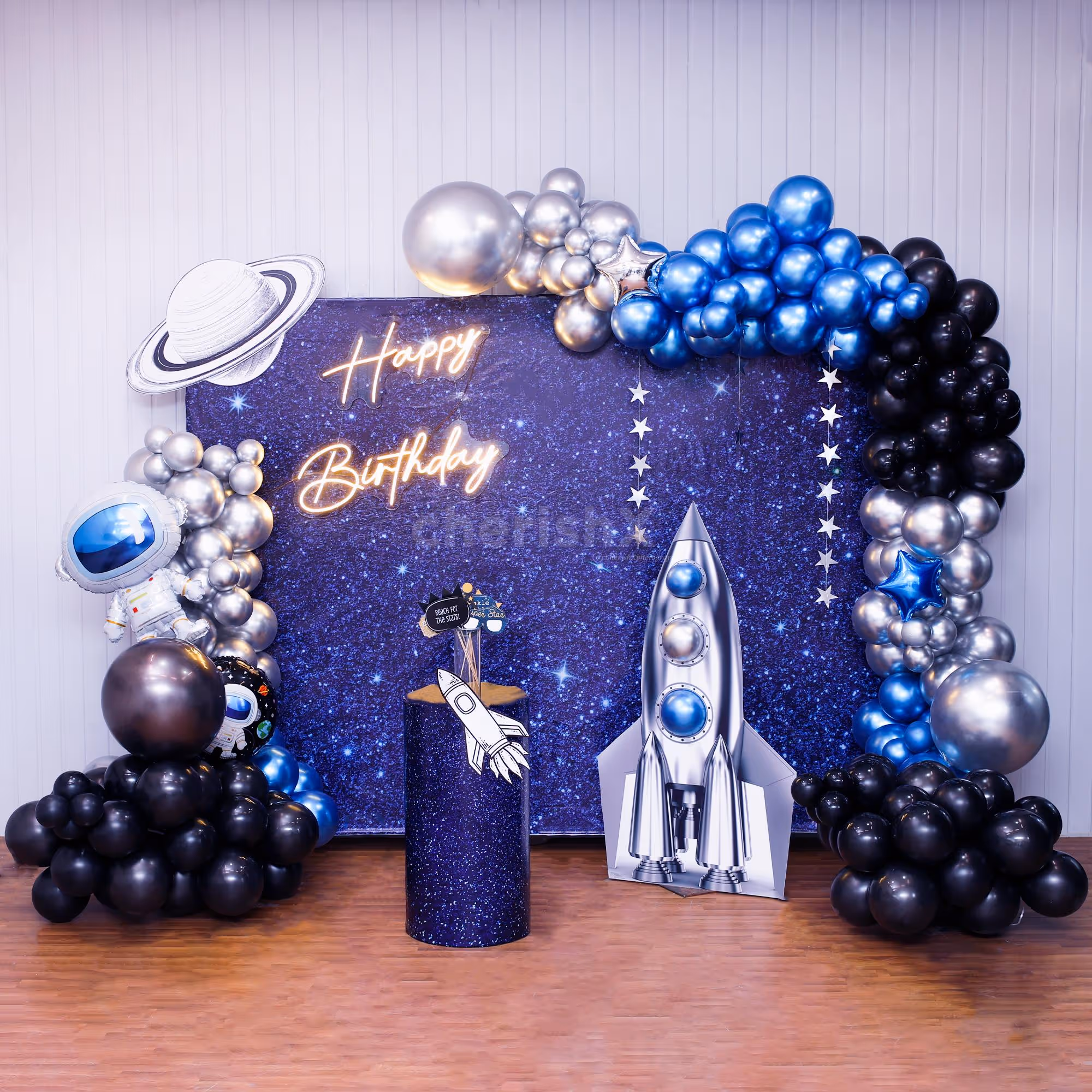 Astronaut-themed flex backdrop with planets, rockets, and beyond.