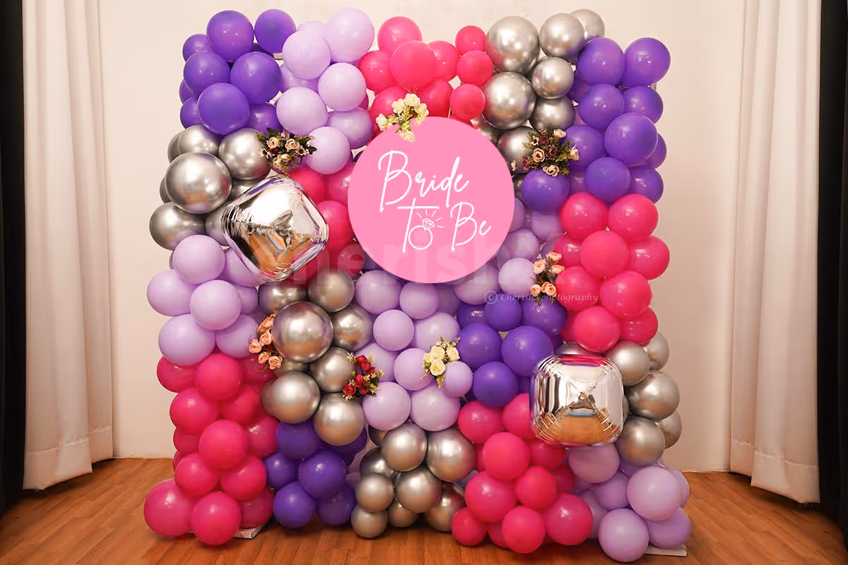 Have an unforgettable bridal shower with these special purple and silver balloon decorations.