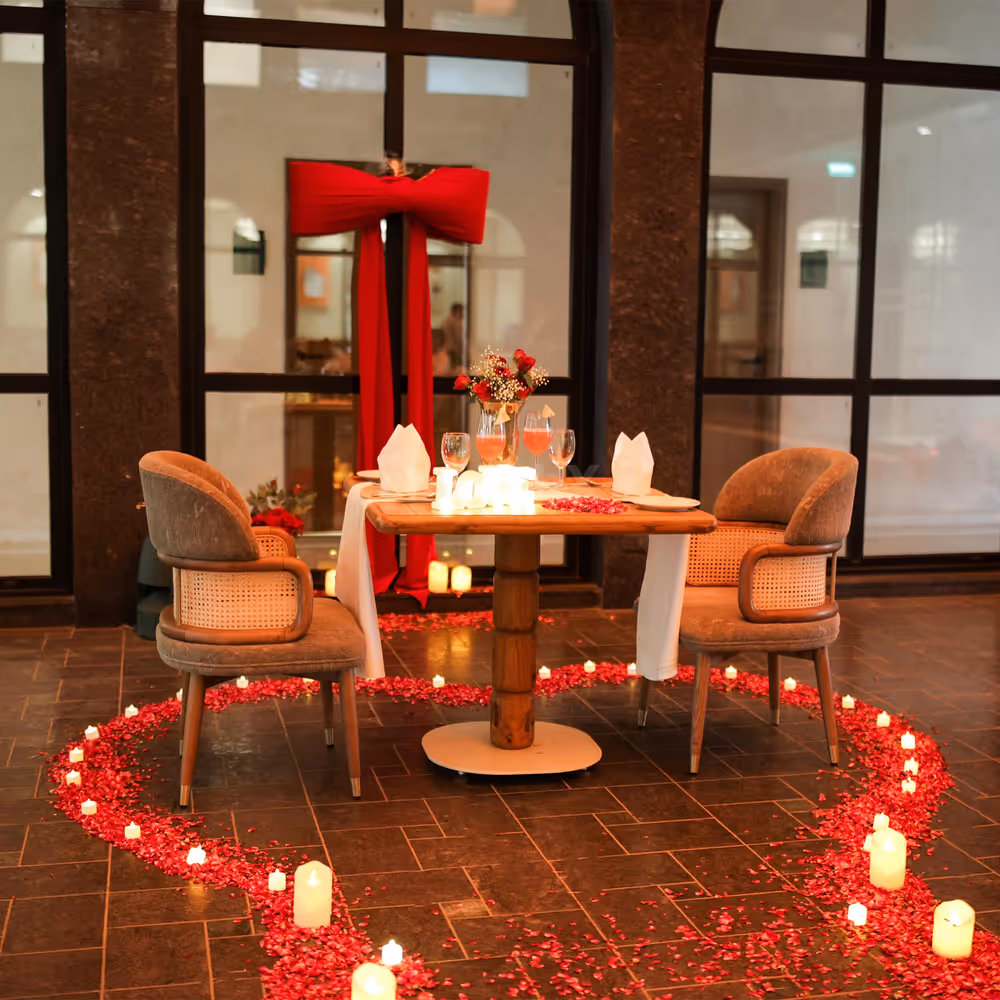 A romantic private courtyard setup with candlelight and floral decor