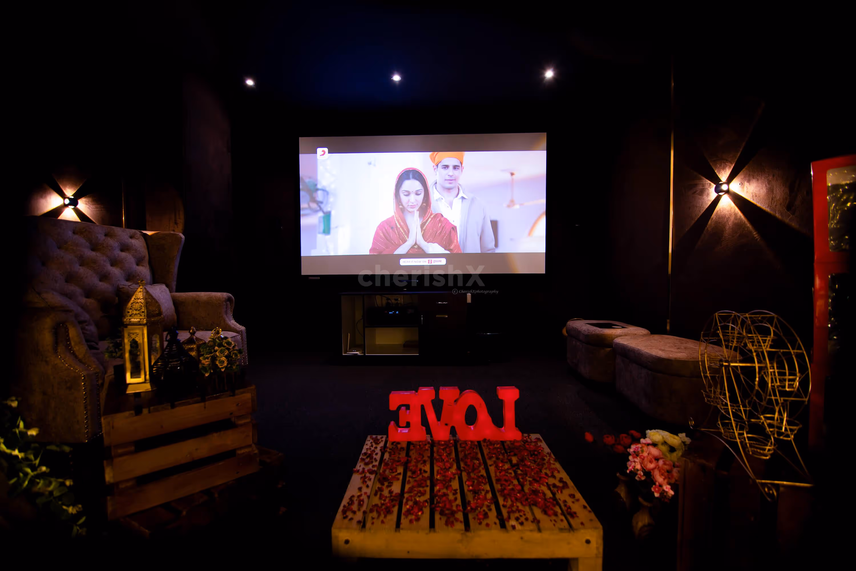 A romantic cabana setup with garlands, lights, and Love LED letters, creating a cosy atmosphere for your special night.
