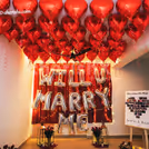 A customizable balloon decor setup adds a special touch to a romantic proposal.
