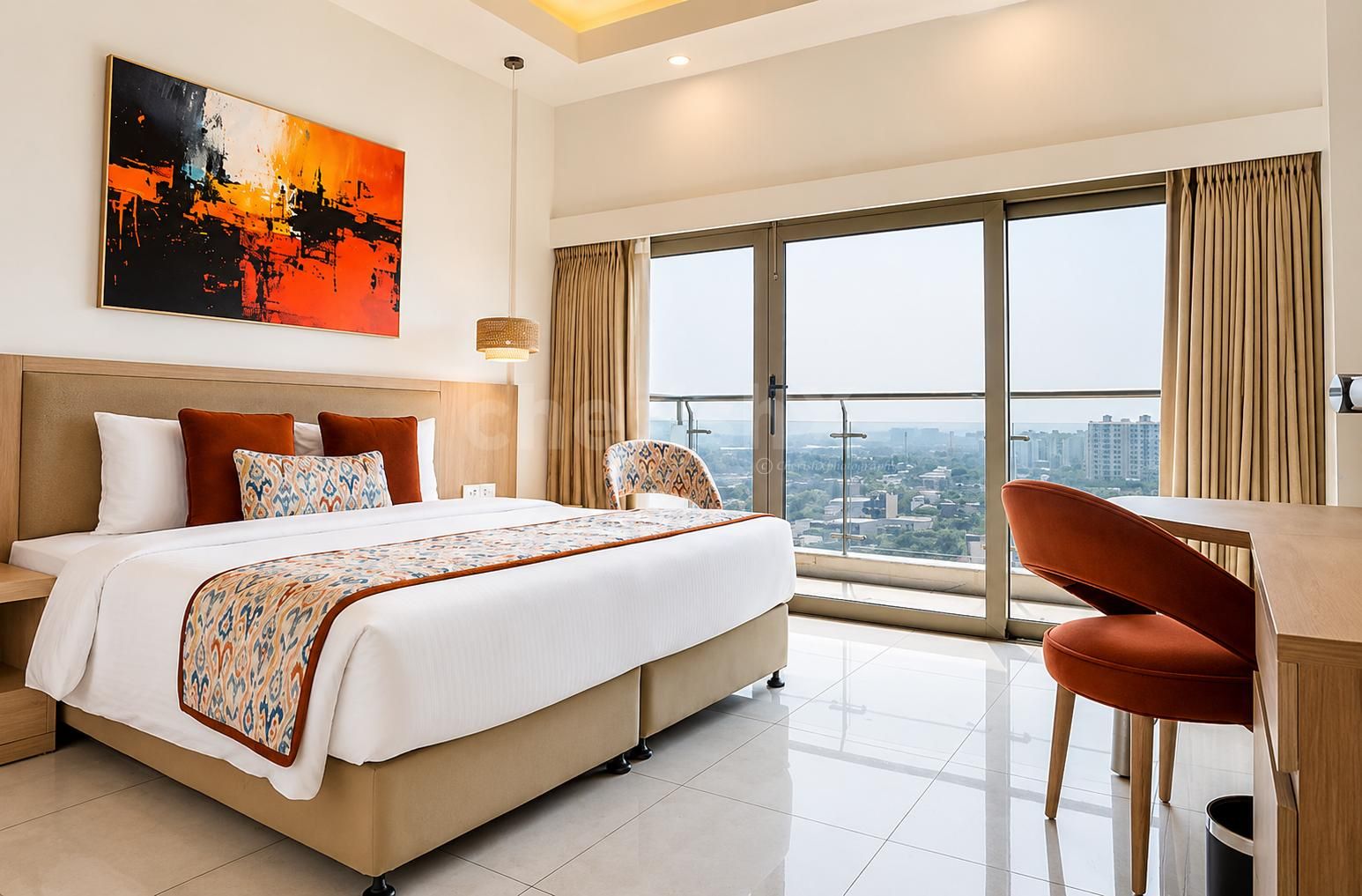 Premium hotel room featuring a compact kitchenette, work table, wall-mounted TV, and elegant modern décor.