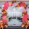 Artistic elements and floral motifs shape a warm, festive welcome.
