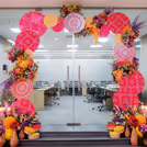 Artistic elements and floral motifs shape a warm, festive welcome.