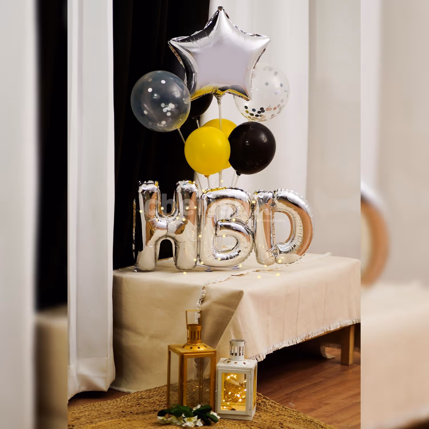 A striking silver birthday balloon bouquet will surprise your loved one