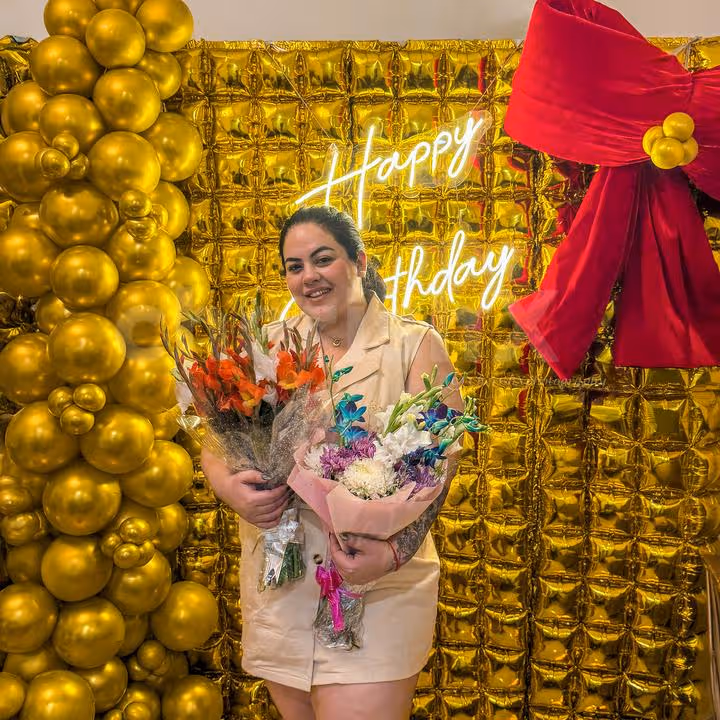 The cone cake table design complements the golden decor theme and celebration