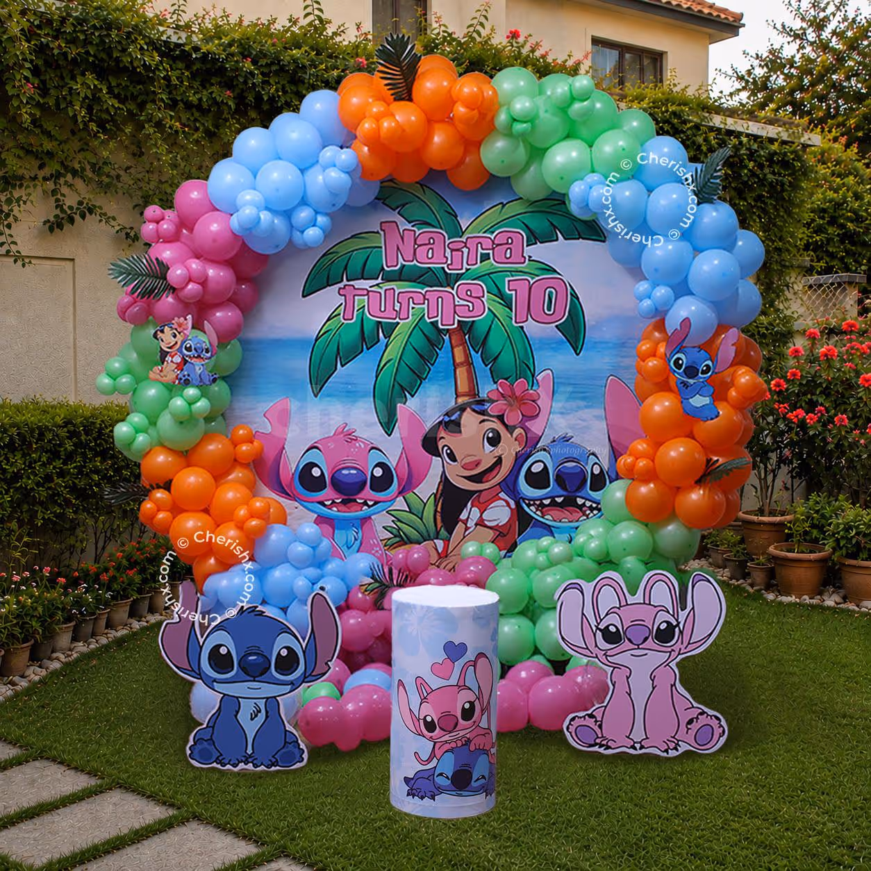 Stitch birthday decoration complete with a colourful arch, themed character cutouts and floating balloons.