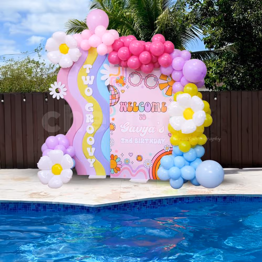 Pastel balloon arch making spot-on poolside ambiance.