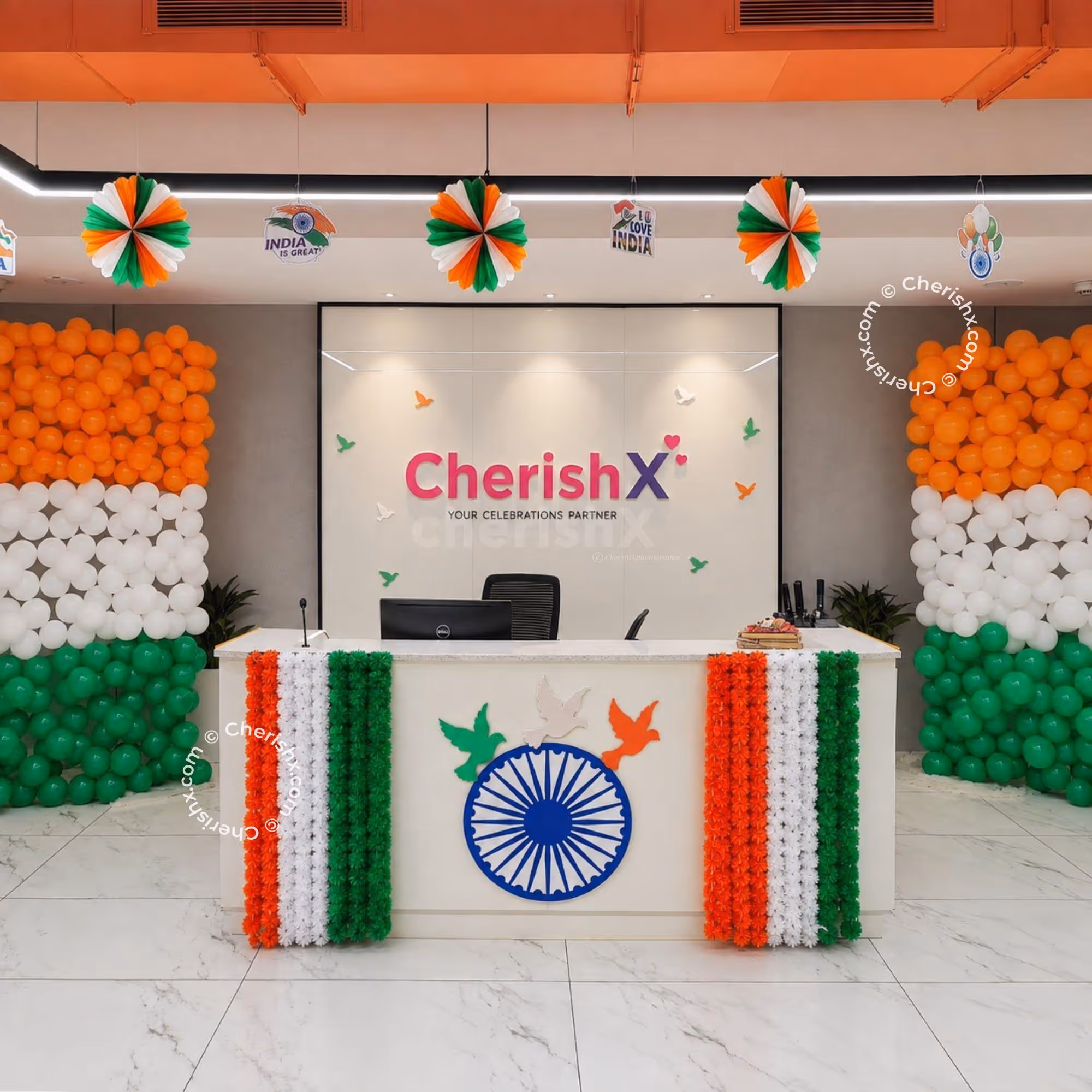 The Tricolour Office Reception Decor for Independence Day has “balloon bunches” in Orange, White and Green colours, floral garlands and Ashoka Chakra.