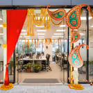 Florals and bright drapes make an impressive festive welcome area.