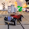Watch the little ones' faces light up with joy as they embark on a magical journey in our vintage car.