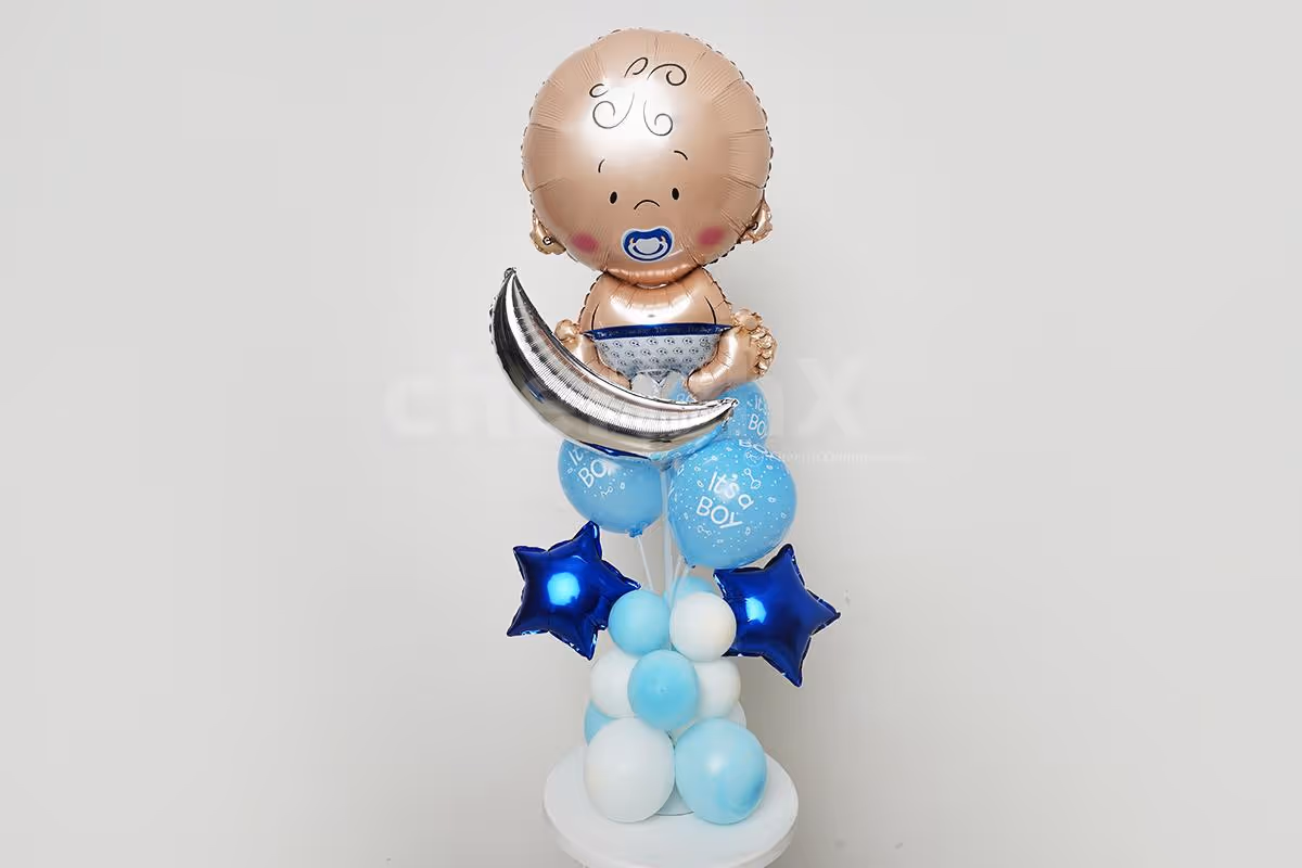A baby boy face foil balloon.